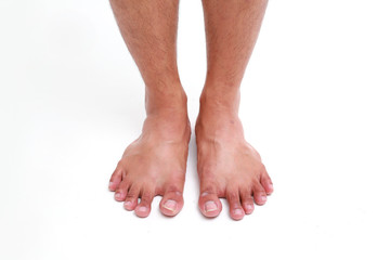 Closeup front view of men legs on white background, health care and medical concept.