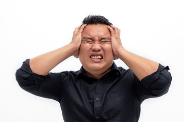 Depressed young asian man suffering from headache, isolated on white background.