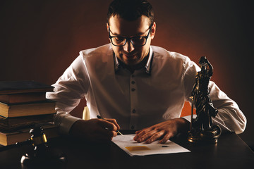 Lawyer working with documents, writing information by pen