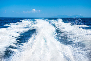 Wake of boat on water surface