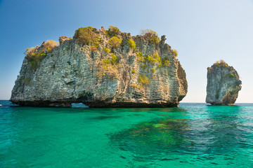 Rocky tropical island in blue sea