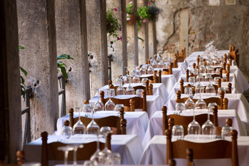 Elegant tables under collonades Venice Italy