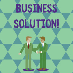 Handwriting text Business Solution. Conceptual photo ideas used to help a company achieve its objectives Two Businessmen Standing, Smiling and Greeting each other by Handshaking