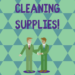 Naklejka premium Handwriting text Cleaning Supplies. Conceptual photo substances usually liquids used to remove dirt and dust Two Businessmen Standing, Smiling and Greeting each other by Handshaking