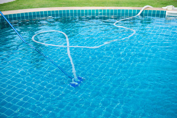 Staff are cleaning the pool.