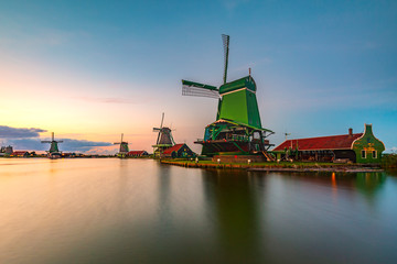 Fototapeta na wymiar Traditional Dutch windmills at dusk, Zaanse Schans, Amsterdam