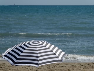 Stripped umbrella at the beach