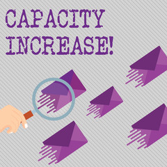 Conceptual hand writing showing Capacity Increase. Concept meaning meet an actual increase in deanalysisd, or an anticipated one Magnifying Glass on Color Envelope and others has Same Shade