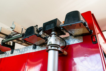 Retractable halogen light on the telescope, placed at the back of the fire truck.