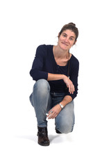 full portrait of woman sitting in the floor on white