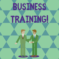Obraz premium Handwriting text Business Training. Conceptual photo increasing the knowledge and skills of the workforce Two Businessmen Standing, Smiling and Greeting each other by Handshaking