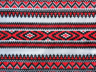 embroidered pattern with red and black threads on a white background, decor element, Ukrainian folk embroidery