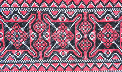 embroidered pattern with red and black threads on a white background, decor element, Ukrainian folk embroidery