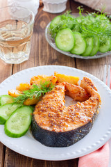 Salmon steak baked with mustard and potatoes, selective focus