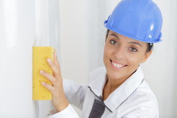 woman washes the wall