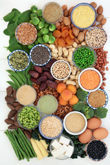 High protein health food collection with legumes, fruit, vegetables, bean curd, dairy, supplement powders, grains, nuts  and seeds. High in dietary fibre, antioxidants and vitamins. Top view.