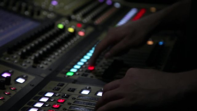 remote recordists closeup. Hand adjusts sound effects. Electric machine on table for working of sound designer or club dj at party in nightclub. Occupation for modern lifestyle, objects for listen at 