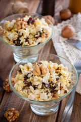 Salad of walnut, chicken and prunes in glass salad bowls, selective focus