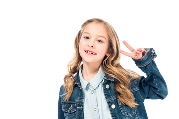 smiling kid in denim jacket showing peace sign isolated on white