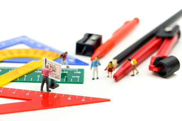 Miniature people : teacher and student with Group of stationery tools Educational tools supplies back to school concept.