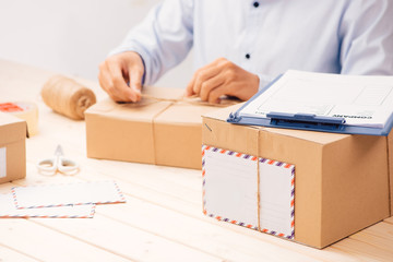 Young business owner packing cardboard box. about shopping online.