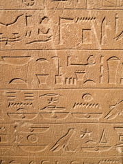 Ancient Egypt tomb hieroglyphs stone wall background