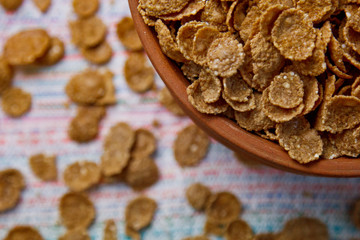 Sugarcorn flakes in a ceramic bowl closeup top view. light breakfast on the table close up. food fast cooking. healthy food, diet