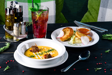 Two plates with the meal on the table, view from above