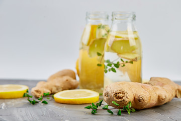 Detox water in bottles with ingredients, ginger, lemon, mint