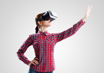 Girl in mask experiencing virtual reality as new entertainment device