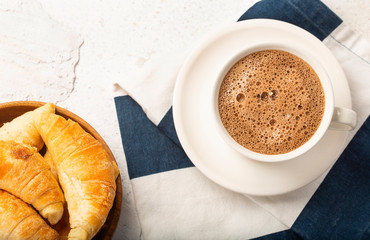 Chocolate hot drink with croissant - Top view