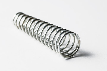 Metal spring isolated on white background