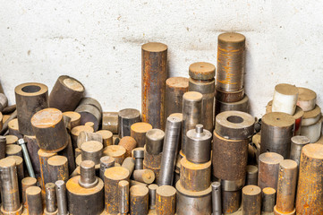 Lathed metal bar stack on factory floor