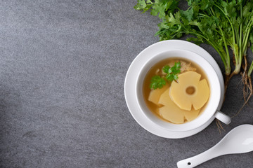 Bamboo shoot soup or bamboo shoot boiled with pork in white bowl on the concrete table background.