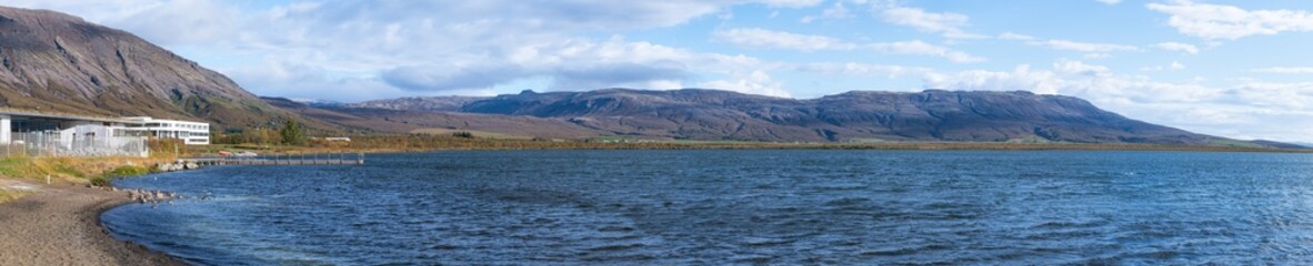 Laugarvatn, Iceland buildings by lake shore water with Icelandic nordic Scandinavian modern architecture during day on golden circle