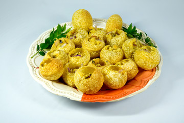 delicious and spicy home made pani puri plate on white background