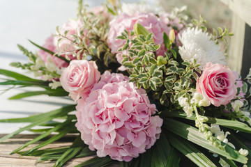 wedding bouquet with rose bush, Ranunculus asiaticus as a background