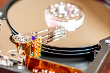 Close-up of an operating computer harddisk reading and writing data