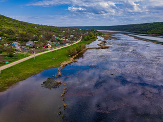 Arial view over the river and small village.