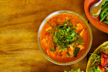 Tomyum(Thai spicy soup) serve in a bow view from top view.