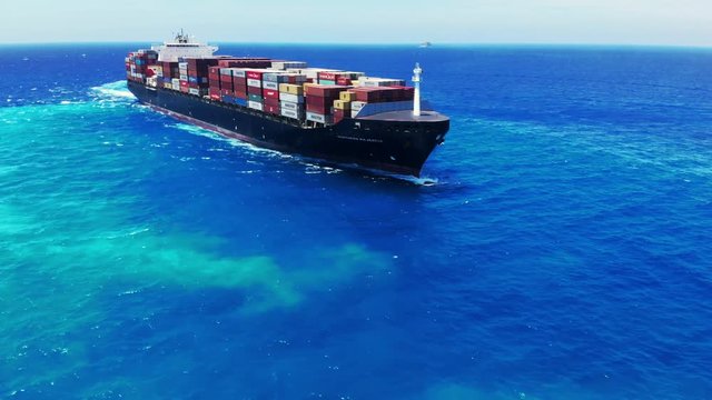Tug Boat & Container Cargo Ship At Sea Near Freeport Harbor Freeport Bahamas