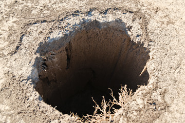 The collapse of the soil is a deep pit.