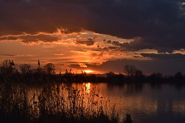 Sunset on the lake in orange and purple 