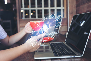 Internet of Things (IoT), Business woman using laptop computer and hand holding mobile smart phone...