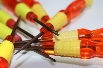 small red-yellow screwdrivers on table