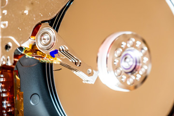 Close-up of an operating computer harddisk reading and writing data