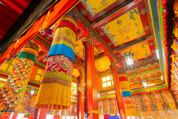 Fototapeta na wymiar Colourful interior decoration of a Buddhist monastery in Ralong, Sikkim, India