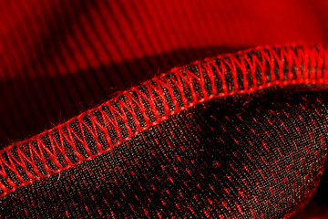 red sportswear closeup top view. seam and juncture inside out. breathable knitwear. clothing...