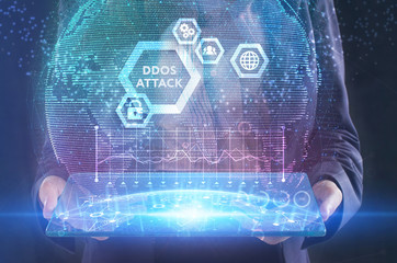 The concept of business, technology, the Internet and the network. A young entrepreneur working on a virtual screen of the future and sees the inscription: Ddos attack