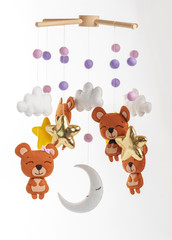 Colorful and eco-friendly children's mobile from felt. On gray background.
